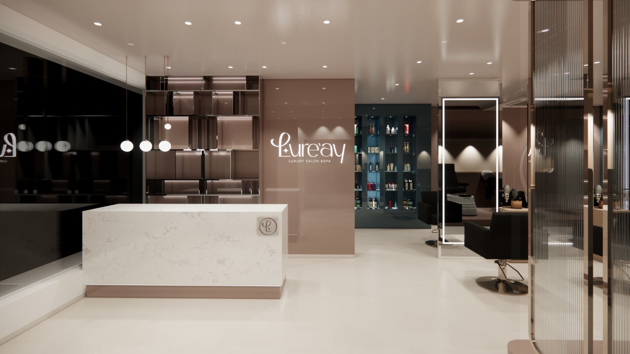 Reception lounge of Lure'ay Luxury Salon with marble front desk and gold wordmark wall